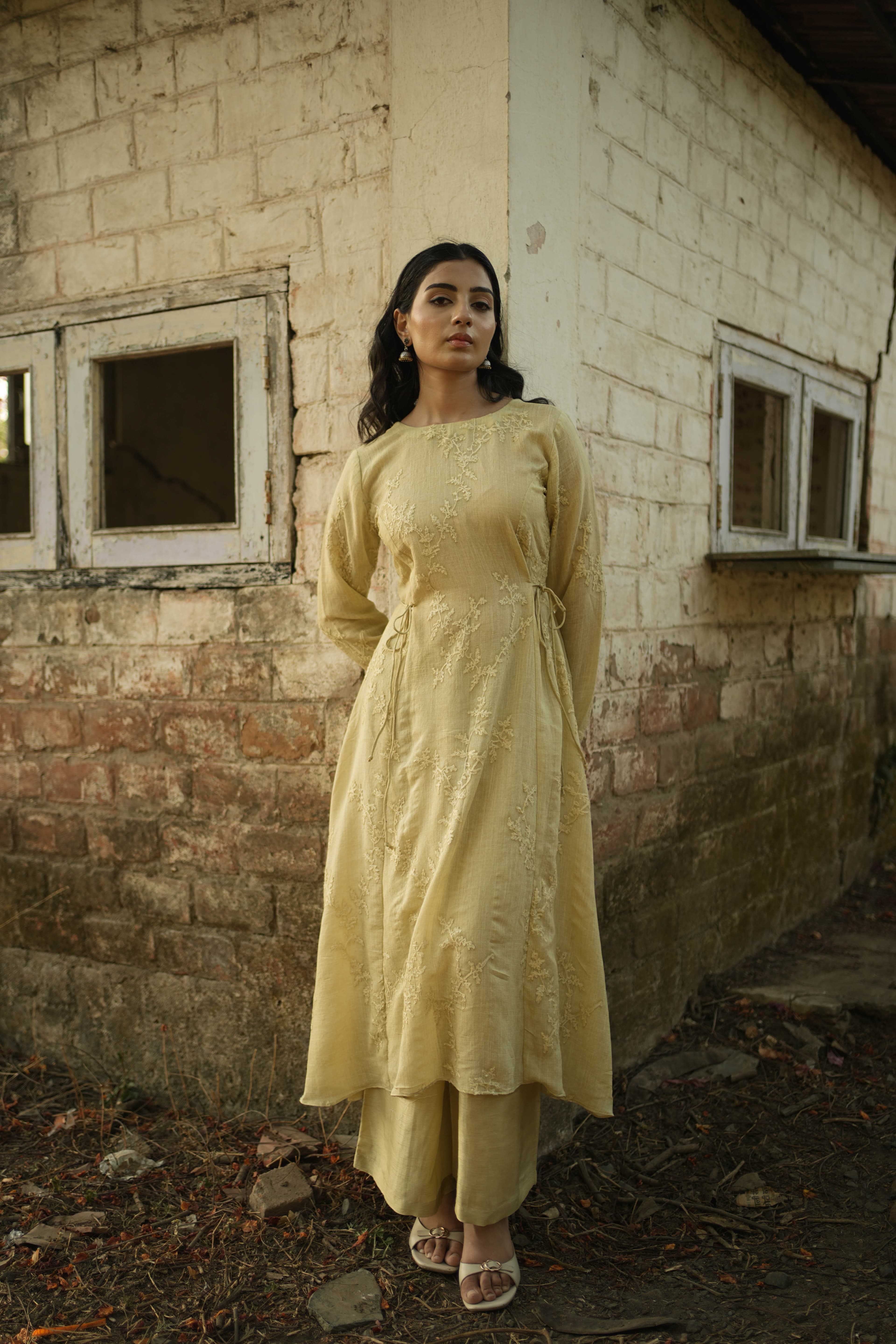 Woman wearing the Marigold Linen set in a warm yellow tone
