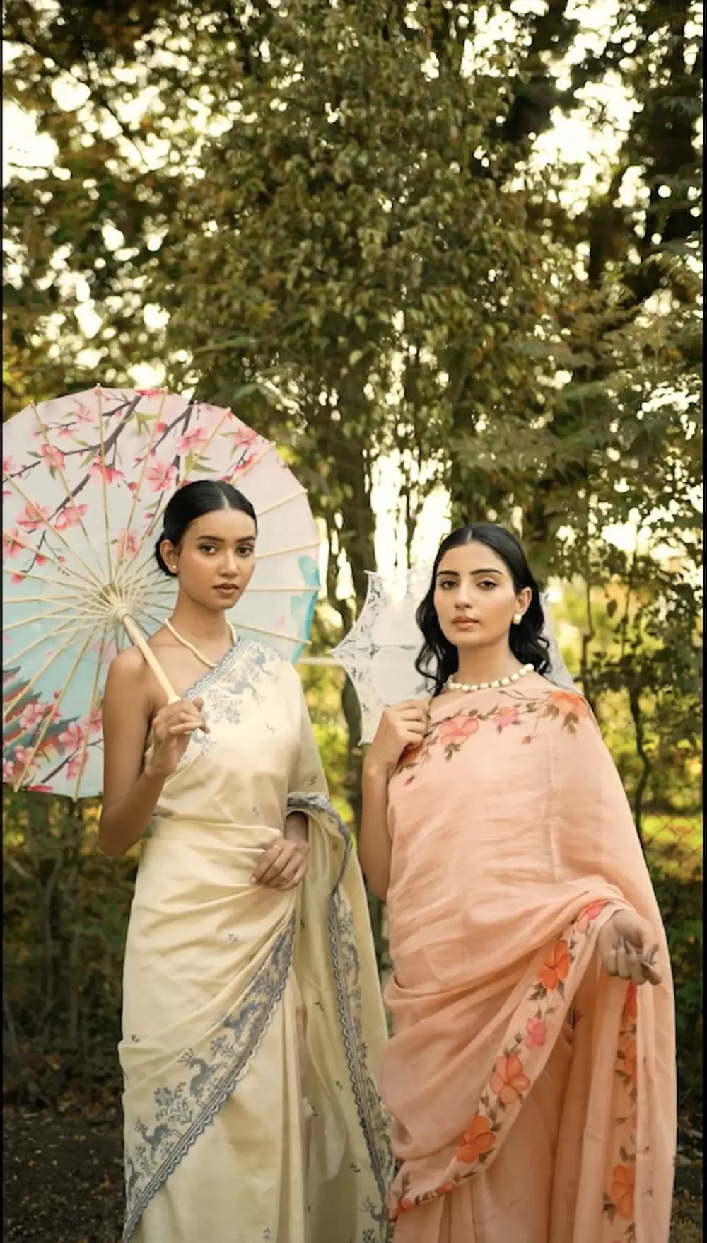 Woman in a peach floral saree framed by warm natural light
